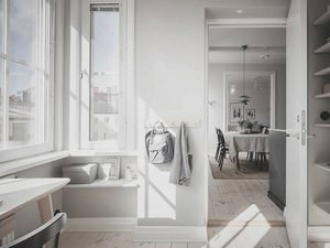  Просторная шведская квартира с тёмно-серой кухней и рабочей зоной в спальне 